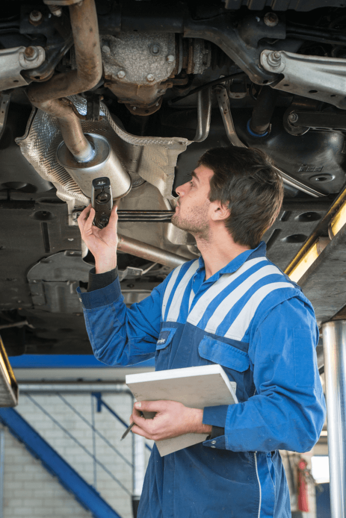 Mechanic inspecting a vehicle - MOT Glasgow